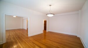 vacant dining area with hardwood floors and hanging lighting at 2800 ontario road apartments in adams morgan washington dc