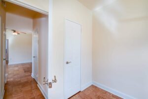 hallway view of living area with hardwood flooring at 1401 sheridan apartments in washington dc