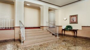 lobby lounge with stairs to apartment homes at 2801 pennsylvania apartments in randle highlands washington dc