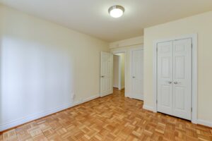 vacant bedroom with hardwood floors and closet at sherry hall apartments in washington dc