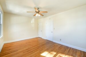 bedroom with wood floors and ceiling fan at 3101 pennsylvania apartments in randle highlands washington dc