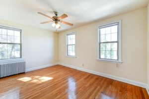 bedroom with ceiling fan and wood floors at 3101 pennsylvania apartments in randle highlands washington dc
