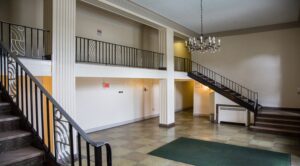 lobby lounge with stairs to apartment homes at 3101 pennsylvania apartments in randle highlands washington dc