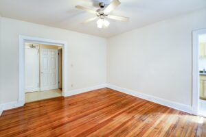 living area with wood floors and ceiling fan at mount pleasant apartments in nw washington dc