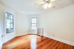 living area with hardwood floors and ceiling fan at mount pleasant apartments in nw washington dc