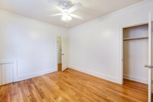 bedroom with large closet, wood flooring and ceiling fan at 3213 Wisconsin apartments in cleveland park washington dc
