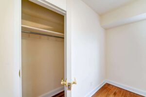 large closet with shelving and coat hooks at 4031 davis place apartments in glover park washington dc