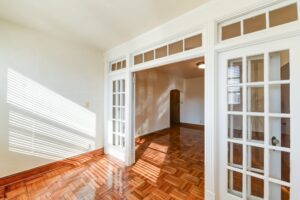 sunroom with hardwood floors, french doors and large windows at the eddystone apartments in washington dc
