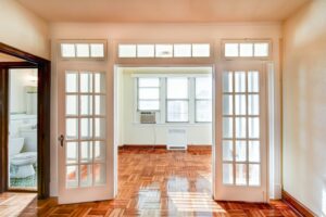 sunroom with hardwood floors, french doors and large windows at the eddystone apartments in washington dc