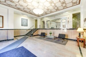 lobby lounge with social seating and stars to elevators at the eddystone apartments in washington dc