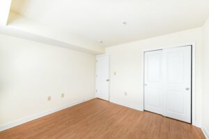 bedroom with large closet and wood flooring at jasper place tax credit apartments in congress heights washington dc