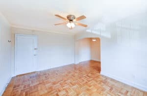 living area with parquet floors and ceiling fan at meridian park apartments in columbia heights nw washington dc