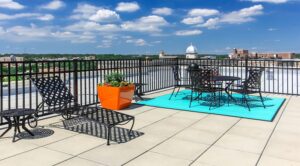 rooftop lounge with social seating and views of the city from the norwood apartments in washington dc