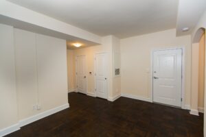 living area with wood flooring and view of front entrance at juniper courts tax credit apartments in takoma washington dc