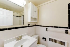 bathroom with vanity, mirror medicine cabinet and mirror at sherry hall apartments in washington dc