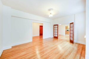vacant living area with wood floor and ceiling fan at 2800 ontario road apartments in adams morgan washington dc