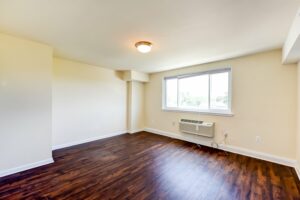vacant living area with hardwood floors at longfellow apartments in brightwood washington dc