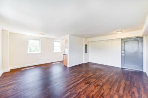open layout of apartment showing living area, dining area and kitchen at longfellow apartments in brightwood washington dc