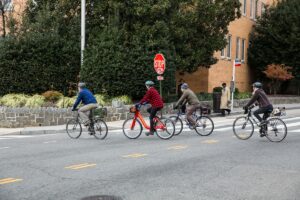 people riding bikes near the dahlia apartments in washington dc
