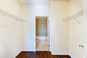 large walk in closet with shelving at archer park apartments in congress heights washington dc