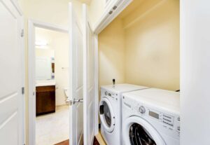 laundry closet with washer and dryer at archer park apartments in congress heights washington dc