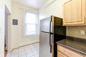 kitchen with stainless steel appliances, tile backsplash and window atthe norwood apartments in washington dc