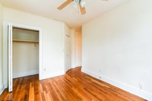 vacant studio apartment with large closet, hardwood floors and ceiling fan at the foreland apartments in capitol hill washington dc