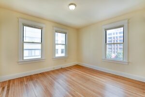 bedroom with wood floors and large windows at twin oaks apartments in petworth washington dc