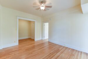 living area with wood floors and ceiling fan at twin oaks apartments in petworth washington dc