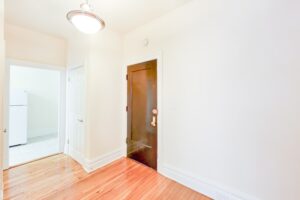 dining area with wood floors and view of front entrance at chatham courts apartments in adams morgan washington dc
