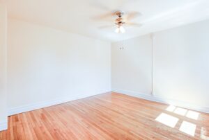 bedroom with wood floors and ceiling fan at chatham courts apartments in adams morgan washington dc