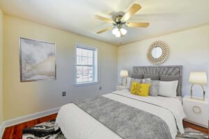 bedroom with hardwood floors, ceiling fan and windows at hillside terrace apartments in washington dc