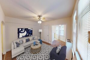 living area with sofa, coffee table, windows and ceiling fan at parkside apartments in adams morgan washington dc