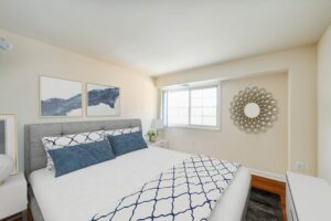 bedroom with wood flooring and window at naylor overlook apartments in se washington dc