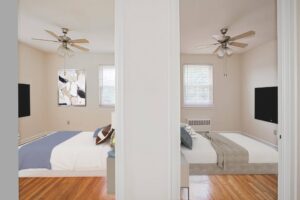 views of both bedrooms of a two bedroom apartment with ceiling fans and hardwood floors at penn view apartments in washington dc