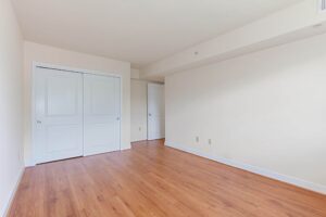 vacant bedroom with hardwood floors and large closet at t street apartments in washington dc