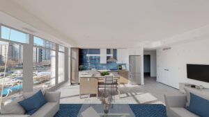 open layout showing living area, kitchen island, floor to ceiling windows and wood floors at the garrett apartments at the collective in washington dc