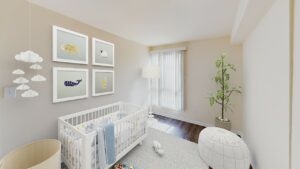 nursery with crib, window, baby decor and wood floors at city towns apartments in washington dc