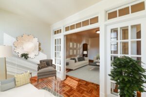 sun room with hardwood floors, sitting area and view of living area at the eddystone apartments in washington dc