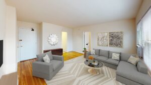 living area with wood floors, view of front entrance and large windows at alpha house apartments in columbia heights washington dc