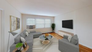 living area with sofa, coffee table, tv, large windows and hardwood flooring at alpha house apartments in columbia heights washington dc