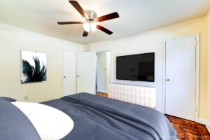bedroom with wood floors and ceiling fan at richman apartments in congress heights washington dc