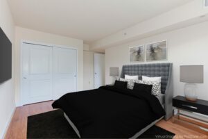 bedroom with bed, nightstands, tv and large closet at t street apartments in washington dc