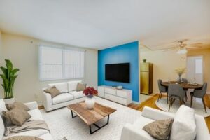 living area with blue accent wall at garden village apartments in washington dc