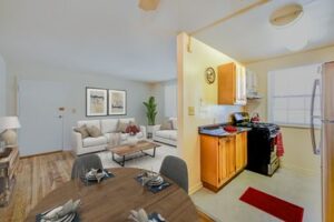 open layout showing living area, dining area and kitchen at garden village apartments in washington dc
