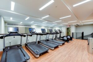 fitness center with cardio equipment at crest at skyland apartments in washington dc