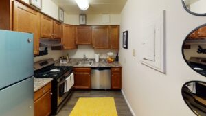 kitchen with stainless steel appliances and hardwood flooring at washington view apartments in washington dc