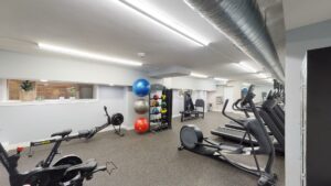gym with cardio machines, strength training machines and exercise balls at 2800 woodley road apartments in washington dc