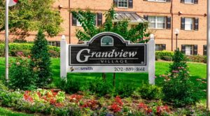 grandview village monument sign with view of building in the background