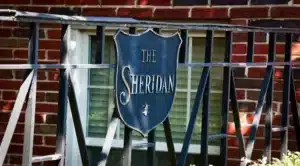 exterior wrought iron sign for 1401 sheridan apartments in washington dc